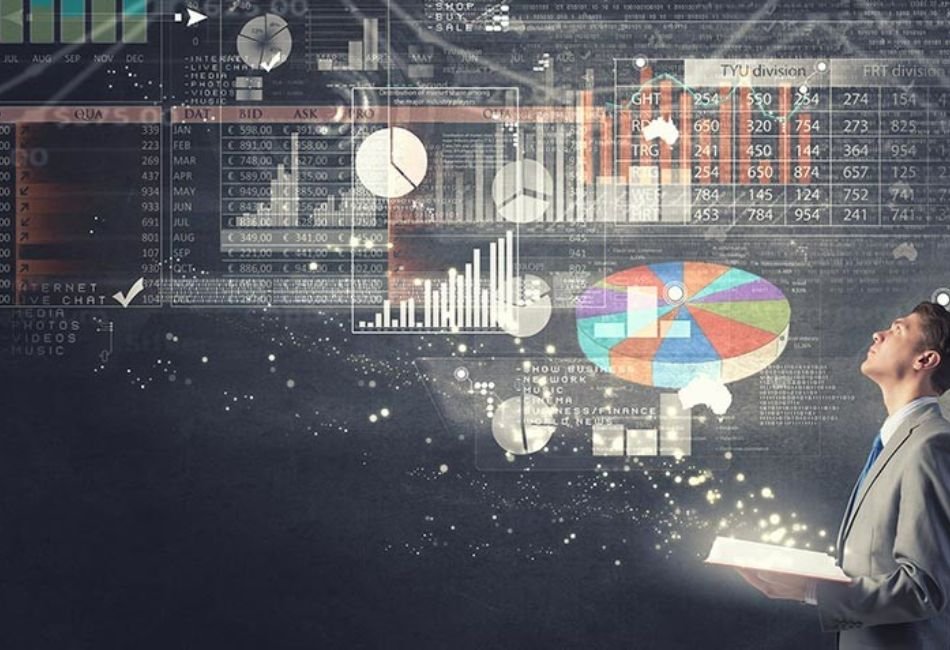 A businessman in a suit holding an open glowing book, from which holographic business data visualizations are emerging - including pie charts, bar graphs, financial tables, and stock market data - floating in a dark futuristic digital space representing business analytics, finance and data-driven decision making.